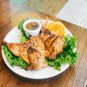 Thai BBQ Chicken, whole hen grilled and served with plum sauce