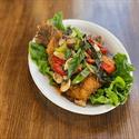 Three Flavor Trout topped with basil and bell pepper